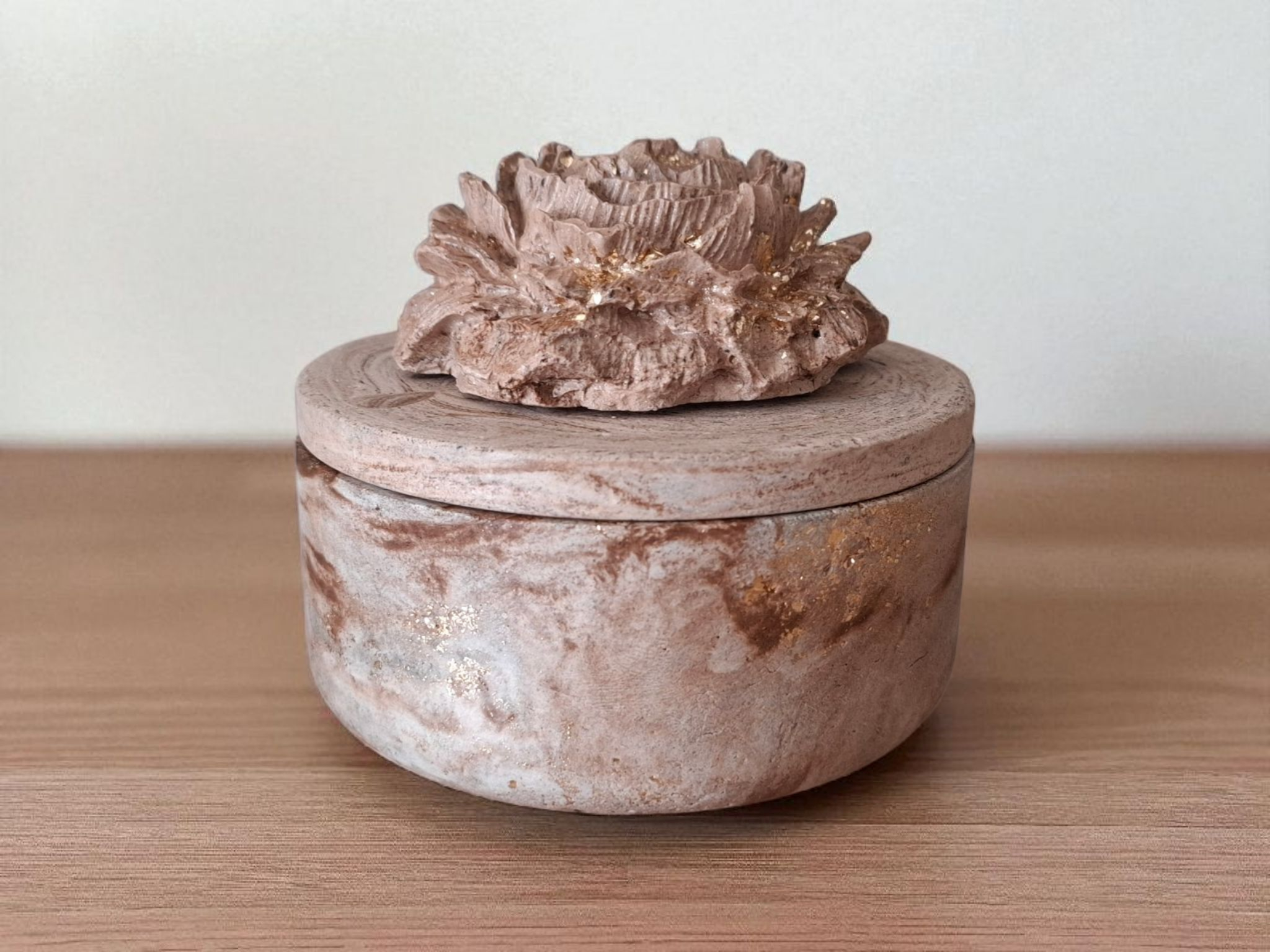 Minimalist handmade candle in gypsum container, sustainable soy wax.