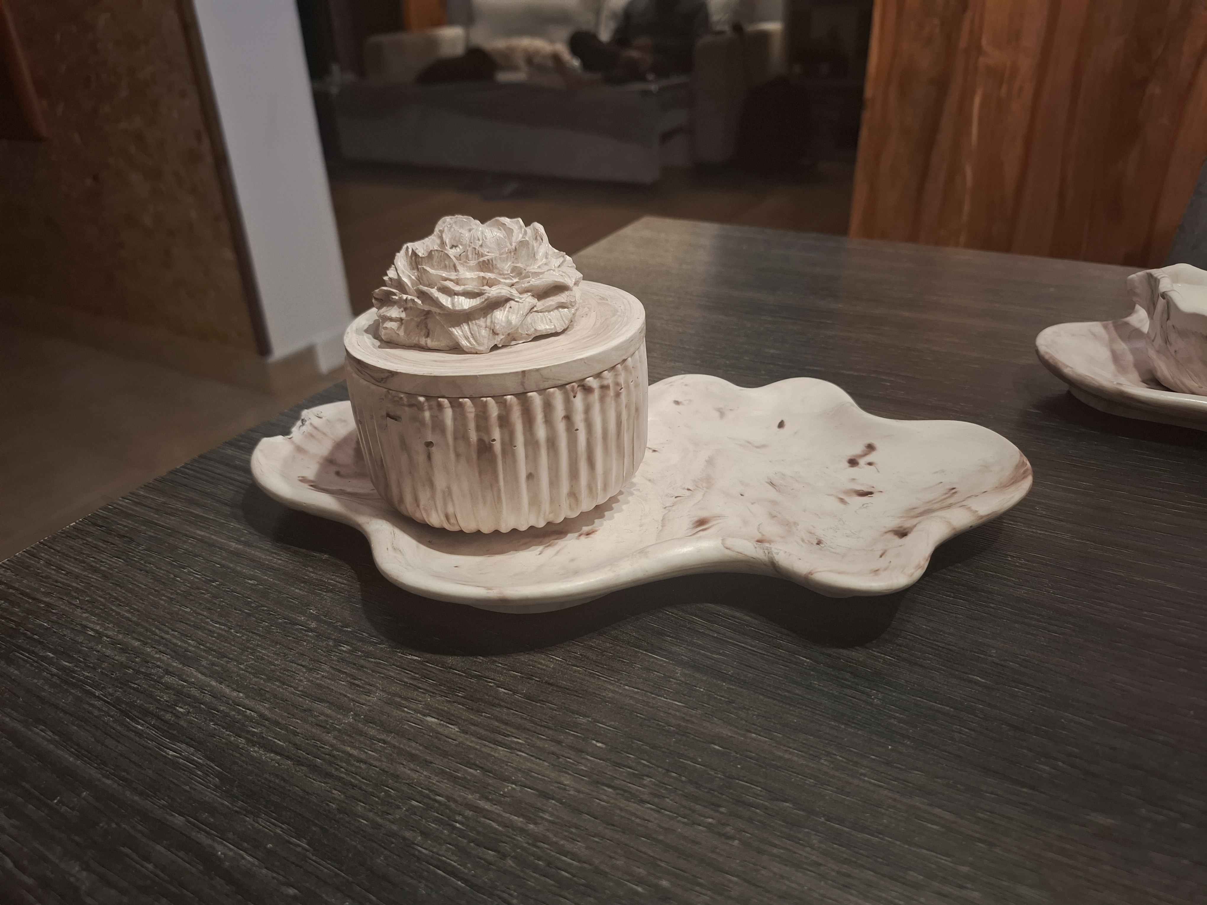 Minimalist handmade candle in gypsum container, sustainable soy wax.