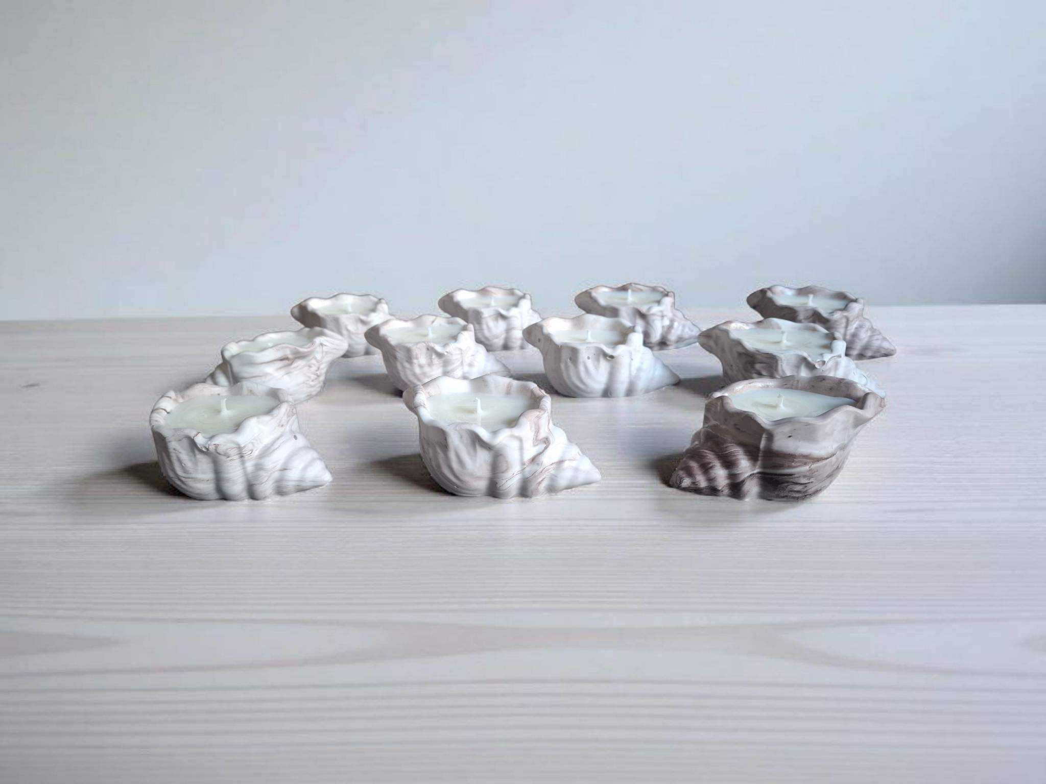 Minimalist handmade candle in gypsum container, sustainable soy wax.