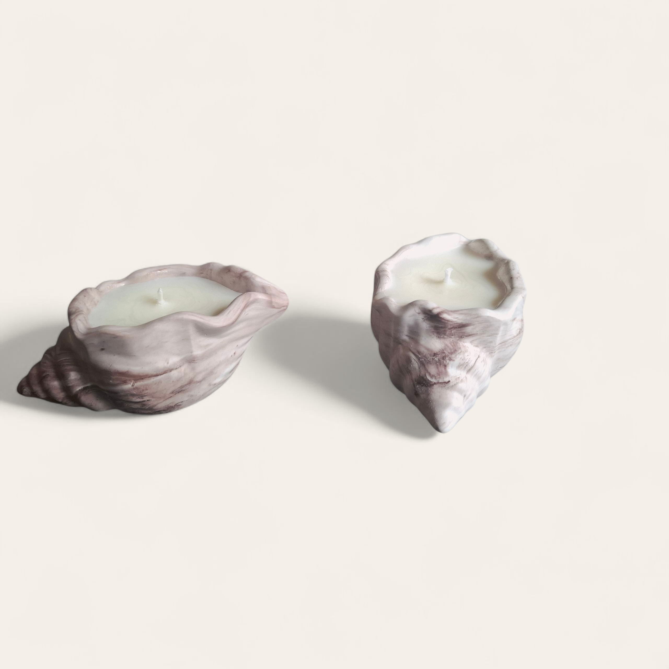 Minimalist handmade candle in gypsum container, sustainable soy wax.